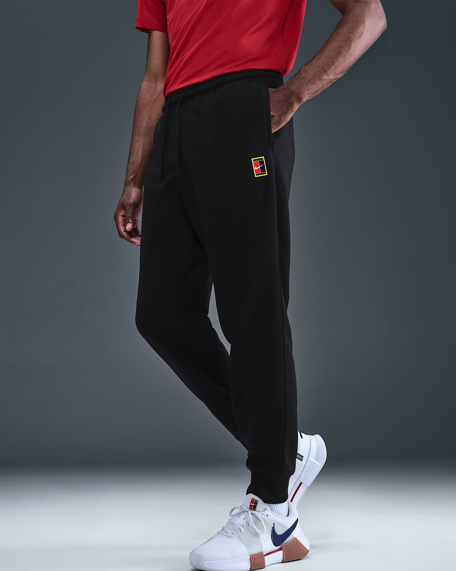ЧОЛОВІЧІ ШТАНИ NIKE COURT NKCT DF HRTGE FLC PNT JGGR (HM6766-010)